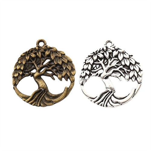 Group view of a spreading tree fills a round openwork frame with a top hanging loop