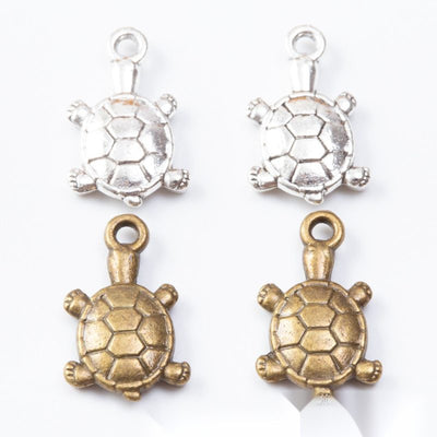 Striped Shell Turtle metal pieces shown in the available finishes.