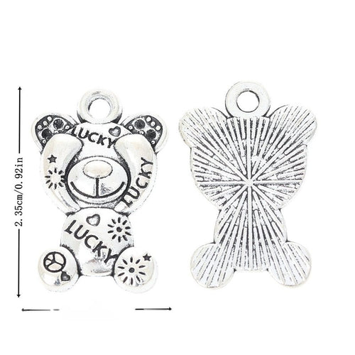 Metal lucky teddy bear charm, front and reverse views shown in the product image