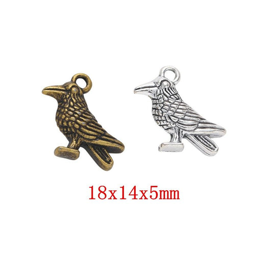 Front display of perched raven charm shown against a plain background.