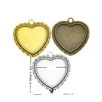 Grouped front view of ornate heart cabochon settings in the available finishes