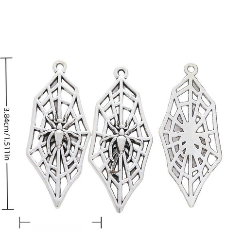 Spiderweb metal charm displaying front and reverse sides
