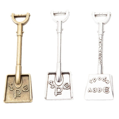 Engraved Shovel Charm finish comparison on a white background
