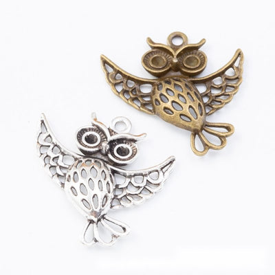 Flying Owl Charm finish comparison on a white background