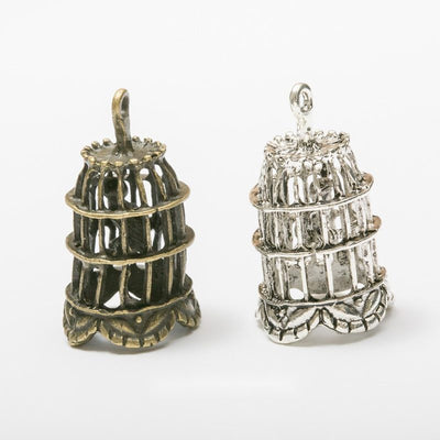 Assorted dimensional birdcage charm pendants displayed together on a white background