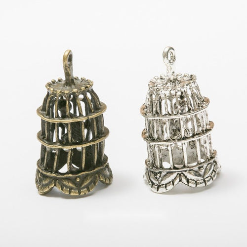 Assorted dimensional birdcage charm pendants displayed together on a white background