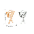 Crossed Comb And Brush Charm In Antique Silver and Light Gold Metal Finish view 1