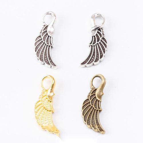 Lobster Clasp Wing Dangle Charms in Three Finishes in multiple metallic finishes displayed together on a white backgroun