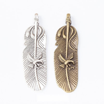 Grouped front views of feather charms