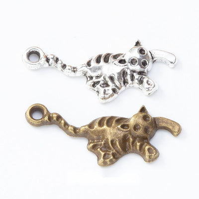 Front and finish comparison of walking cat charm