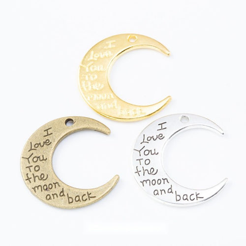 Group view showing the available finishes of engraved crescent moon charms