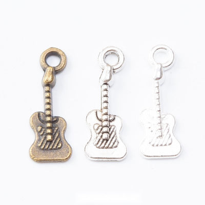 Mixed Electric Guitar Metal Charms in Three Finishes in multiple metallic finishes displayed together on a white backgro
