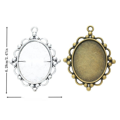 Grouped front view of ornate oval bezel showing a recessed tray and beaded openwork border