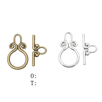 Product photo 1 of the scroll ring toggle clasp highlighting its decorative round ring and straight toggle bar