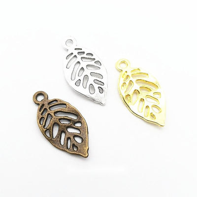 Openwork leaf charm shown across the available finishes