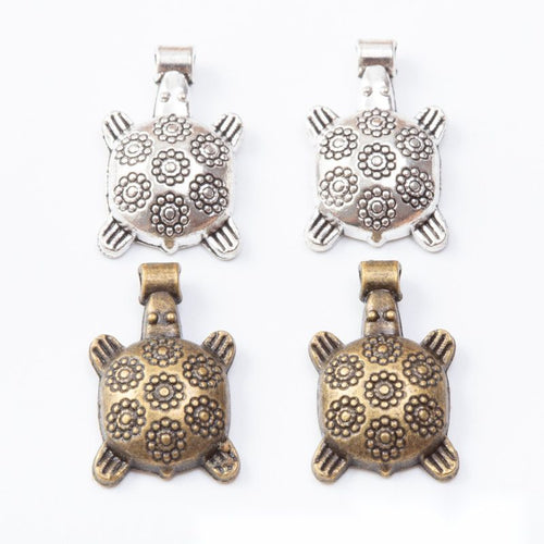 Floral Shell Turtle metal pieces shown in the available finishes.