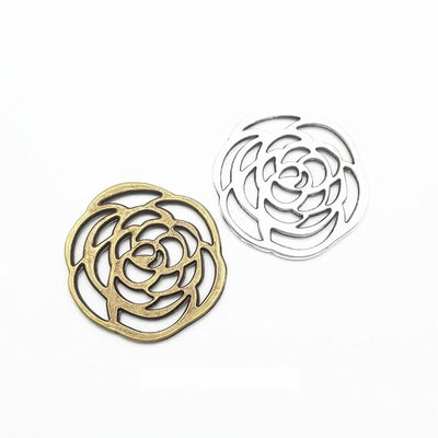 Flat spiral flower made from open petal outlines shown in the available finishes