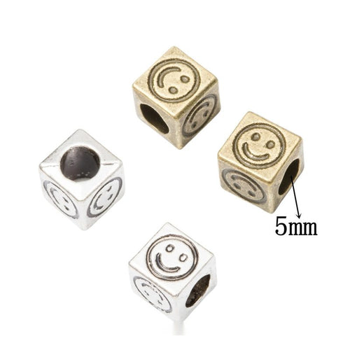 Antique Bronze smiley cube bead shown in product image 1