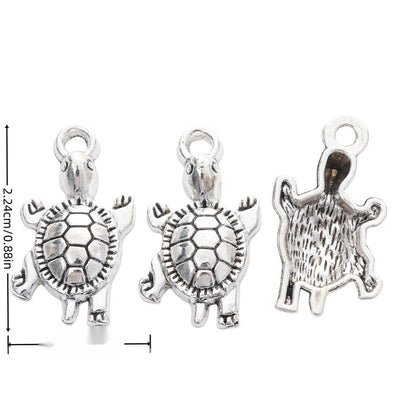 Front view of textured turtle charm showing finish variation 1