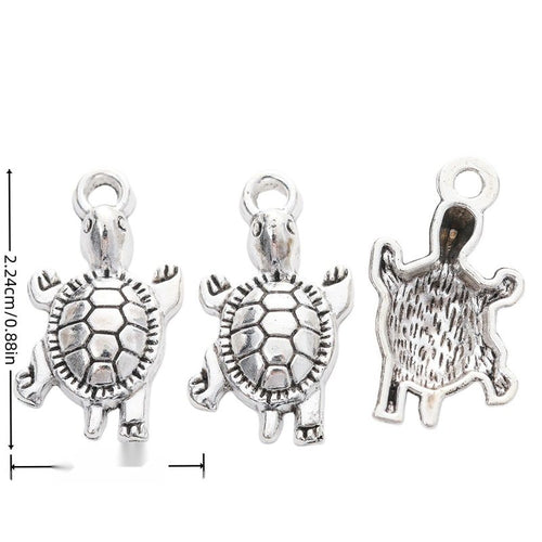 Front view of textured turtle charm showing finish variation 1