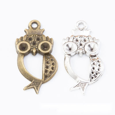 Owl outline with large circular eyes and dotted wing accents shown in the available finishes