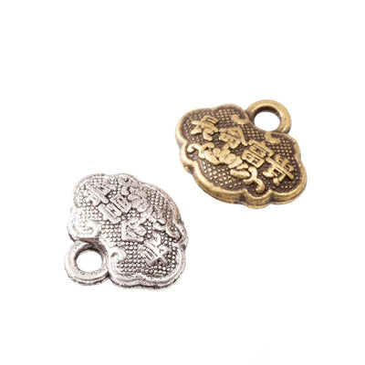 chinese lock shaped metal charms in two antique finishes shown together in the available finishes