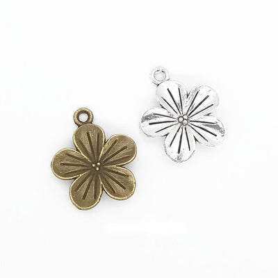 Five Petal Flower metal pieces shown in the available finishes.
