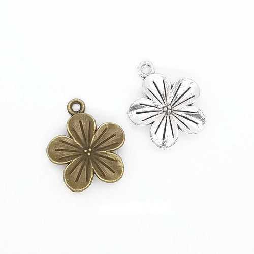 Five Petal Flower metal pieces shown in the available finishes.
