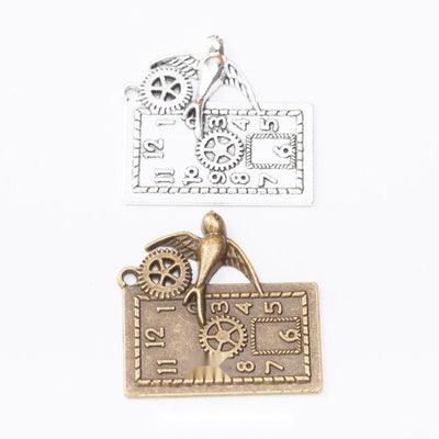 Clock gear charm shown across the available finishes