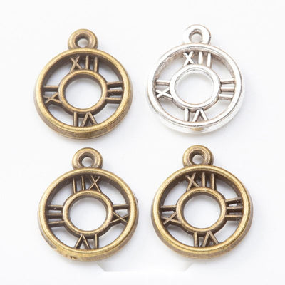Round Roman Numeral Clock Face Metal Charms in multiple metallic finishes displayed together on a white background.