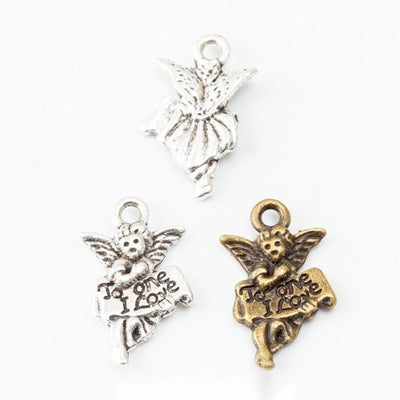 Group view of small winged angel figure with raised details and a top loop