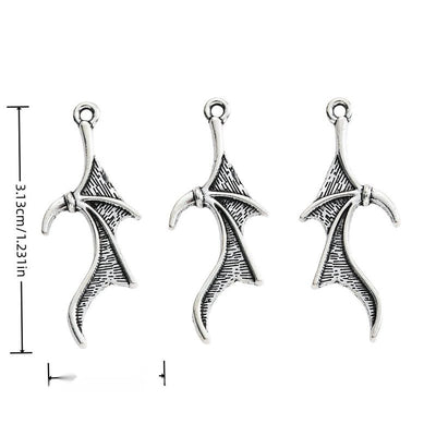 Group view of long bat-wing charm showing all 1 pictured finish variants