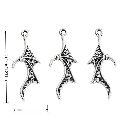 Group view of long bat-wing charm showing all 1 pictured finish variants