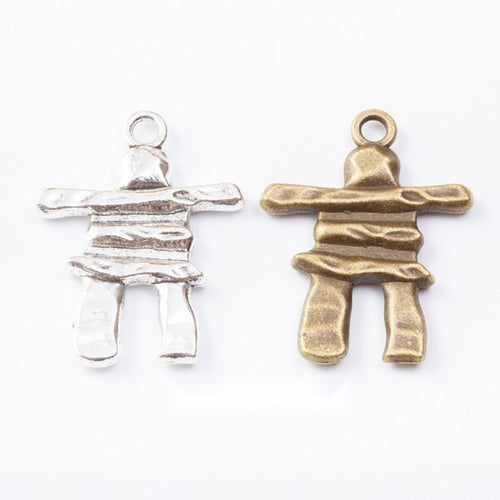 Group view of stacked stone figure charm on a white background