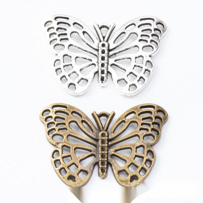 Front view of filigree butterfly embellishment showing finish variation 1