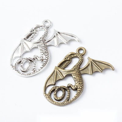 Curled Dragon metal pieces shown in the available finishes.