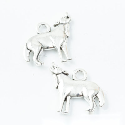 Grouped front view of standing goat charms in the available finishes