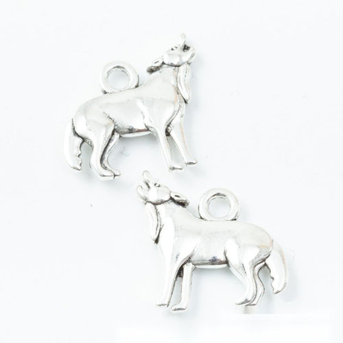 Grouped front view of standing goat charms in the available finishes