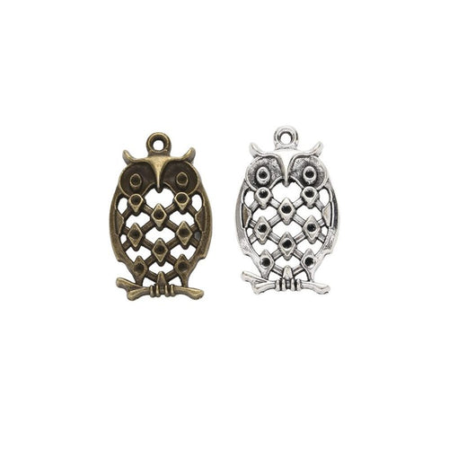 Filigree Owl Charm finish assortment on a white background