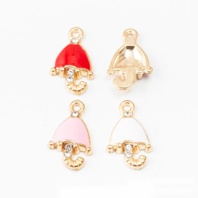 Grouped front view of crystal accent umbrella charms in the available finishes