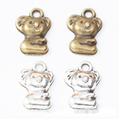 Product view of seated koala charm showing a seated koala with rounded ears, a raised nose, and a top loop