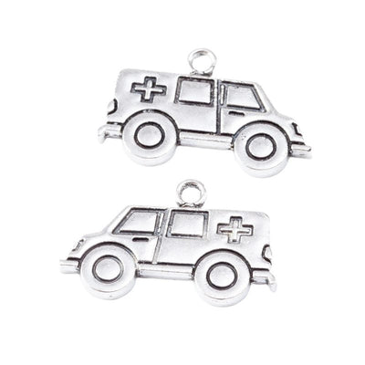 Front-facing arrangement of ambulance charms on a white background