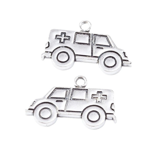 Front-facing arrangement of ambulance charms on a white background