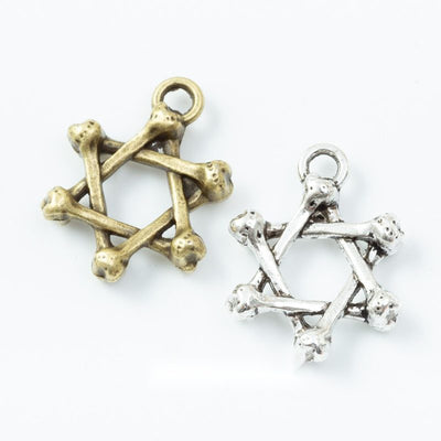 Assorted twig star charms arranged together on a white background