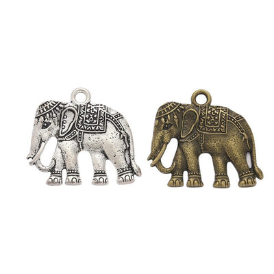 Product photo 1 of the decorated elephant charm highlighting its walking elephant with engraved blanket and THAILAND on 