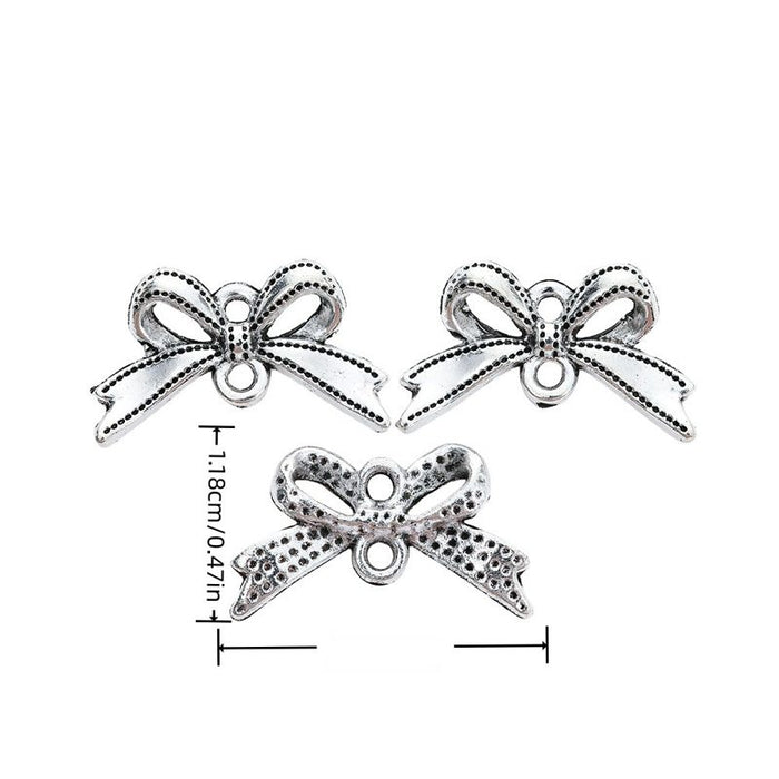 Antique Silver Ribbon Bow Charm With Dotted Texture