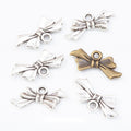 Tied Ribbon Bow Metal Charms in Two Antique Finishes view 1