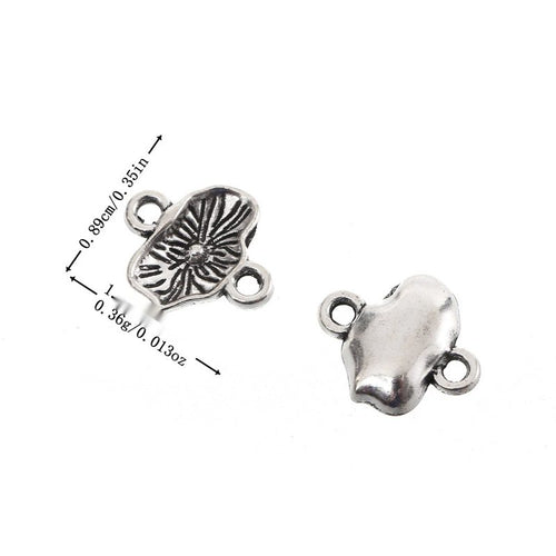 Metal openwork maple leaf charm, front and reverse views shown in the product image