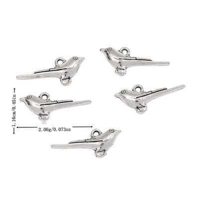 Antique Silver long tail bird charm shown in an overview
