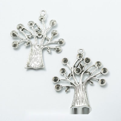 Product view of tree pendant showing a silver-tone tree with a flared trunk, curling branches, round branch tips, and a 